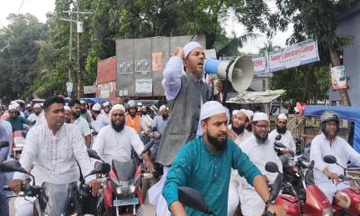 সিংগাইরে দেয়াল ঘড়ি প্রতীকে নির্বাচনি শোভাযাত্রা