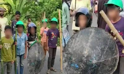 আ.লীগের লকডাউনে অস্ত্র হাতে শিশুদের অবস্থান